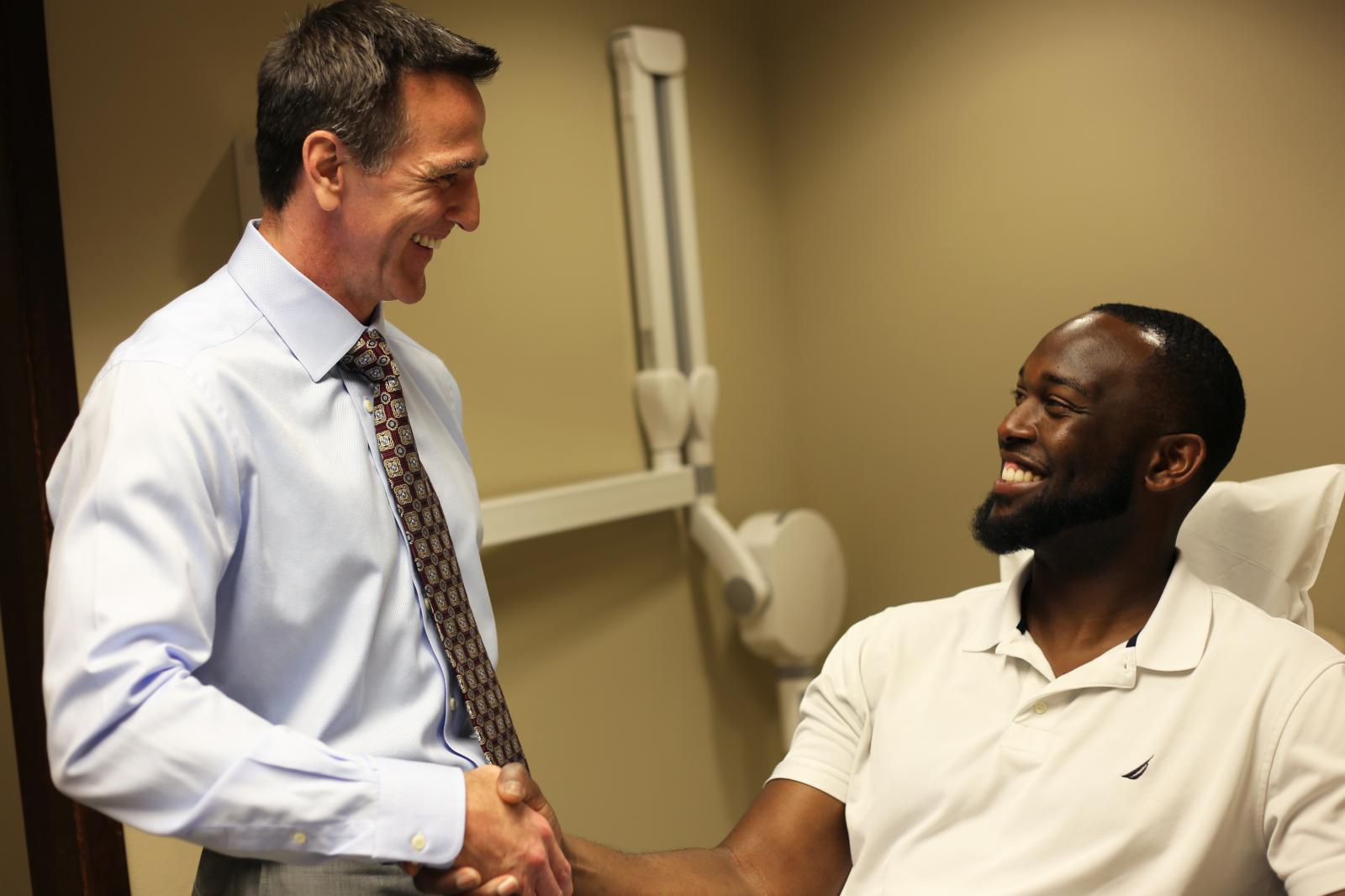 Man shaking orthodontists hand