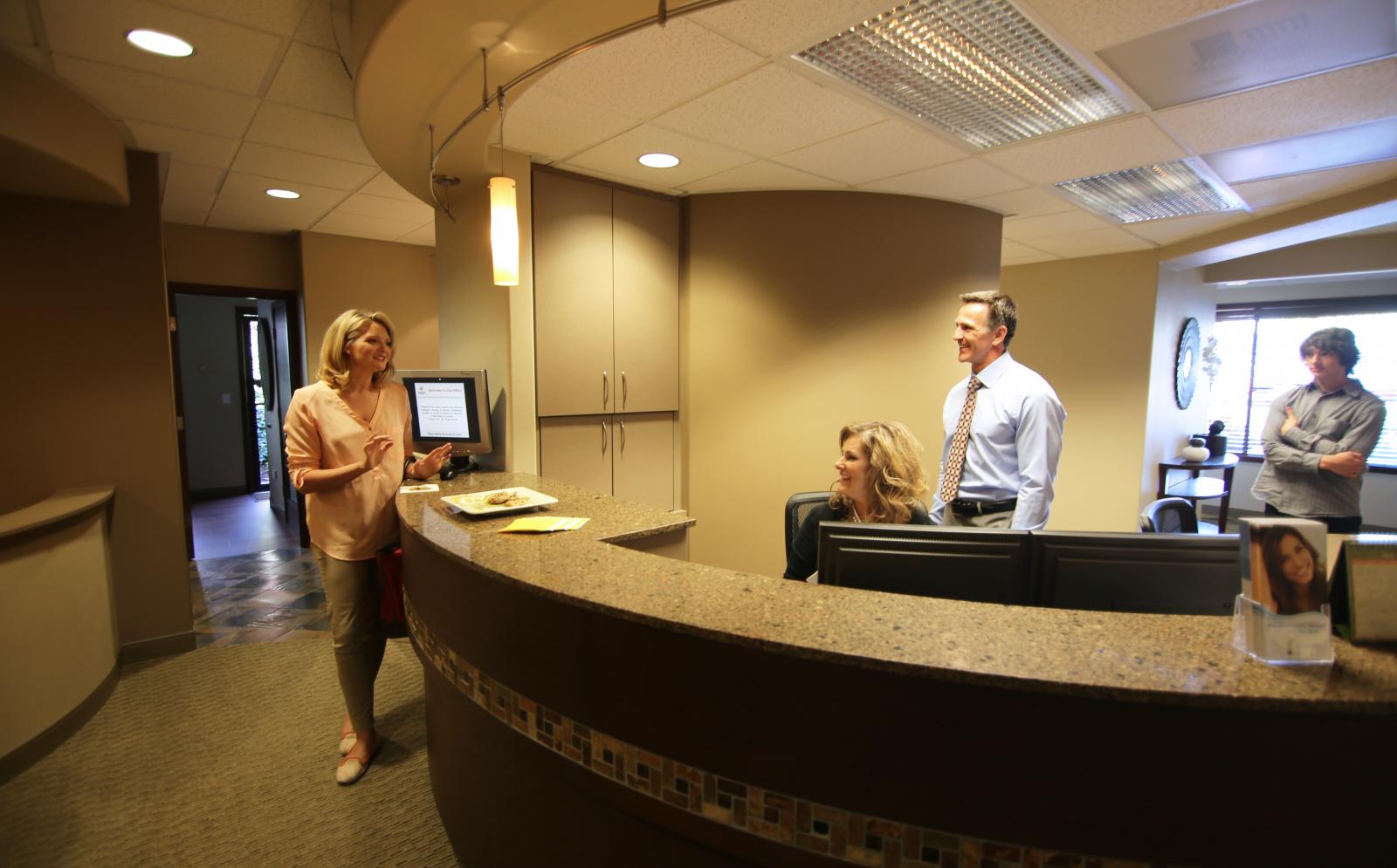 Woman checking in at the reception desk