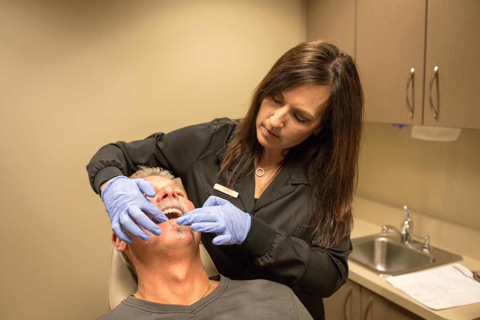 Patient fitting Invisalign Tray